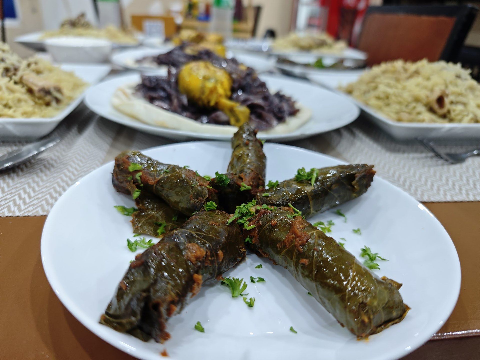 A generous Arabic dinner spread with mahashi — stuffed vegetables
